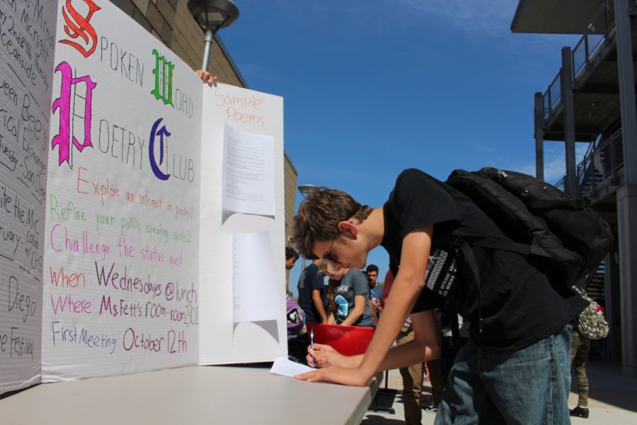 Photographer: Calvin Murphy
Senior, Nic Reynoso, signs up for a favorite club of his during club rush at lunch