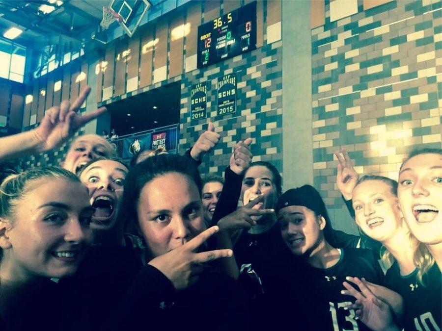 Varsity girls volleyball team poses for a picture after a win over SDA.