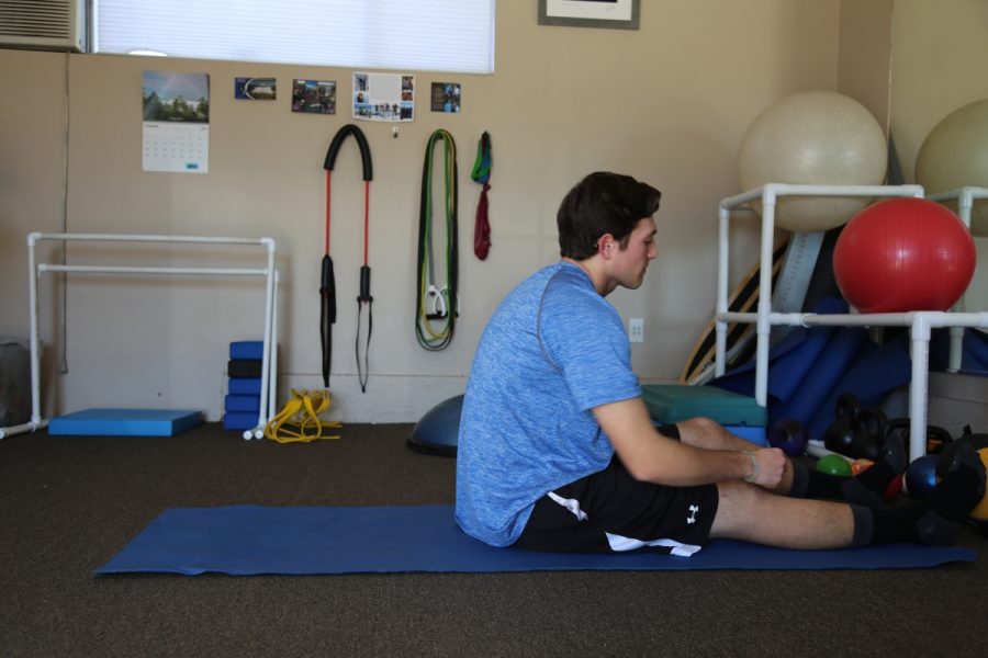 Chris Saiki rests in between physical therapy exercises.