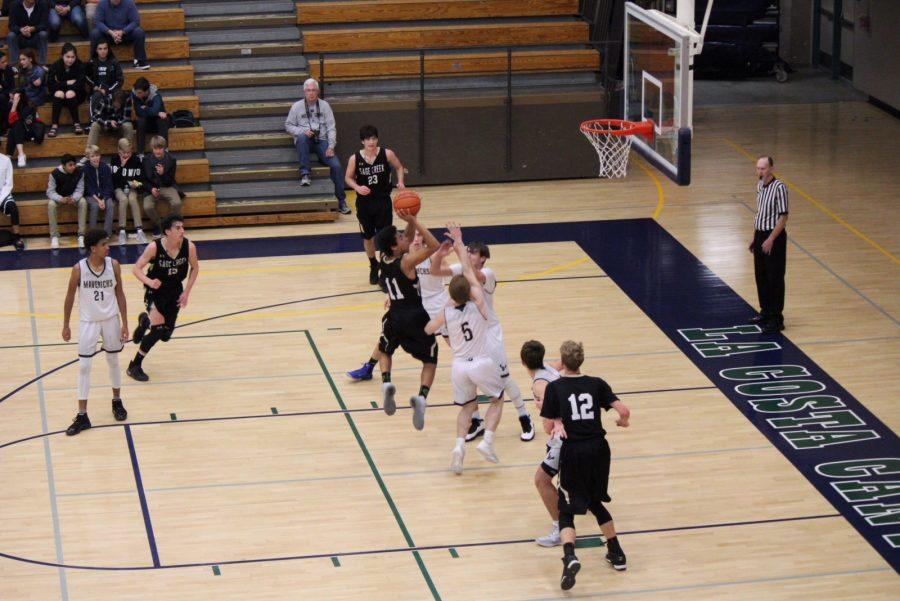 Starting point guard, Xavier Allison, charges into the Maverick defense late in the fourth quarter. His layup was one of many shots that Sage Creek hit in their 14-2 fourth quarter comeback against the La Costa Canyon Mavericks. 