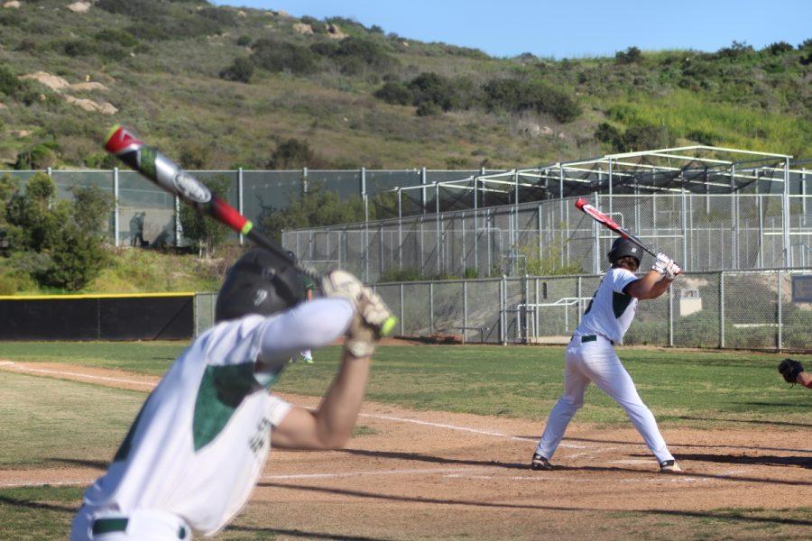 #7 senior Ryan Torres on deck preparing his swing for when he takes the plate.