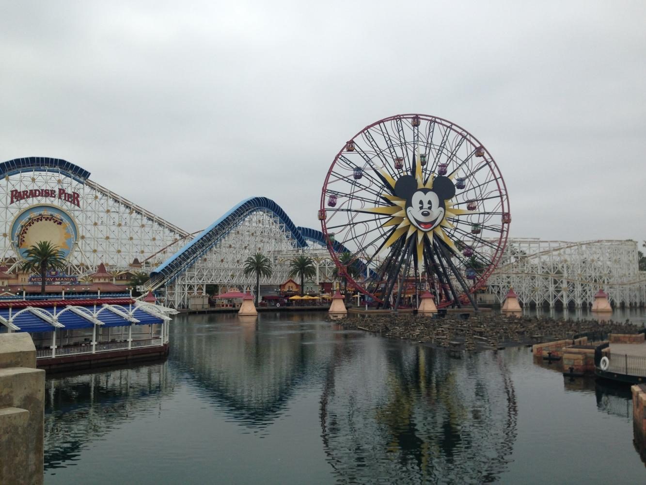 Mickey Mouse smiles out on as guests enter Disneyland and California Adventure