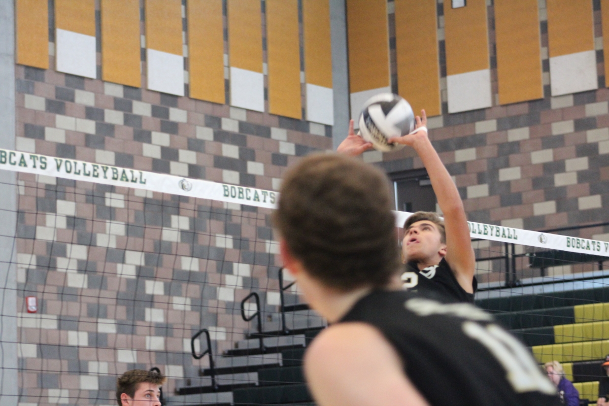 Junior setter Christian Griego looks to set a ¨go¨ to junior outside hitter Christian Janke.