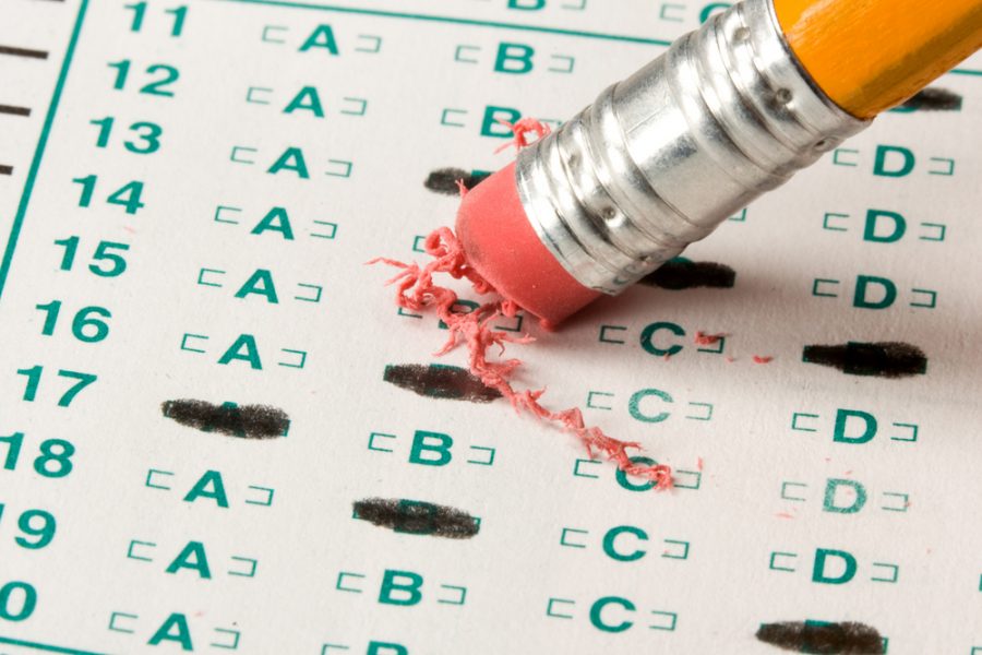 A student double checking their work on a standardized test.