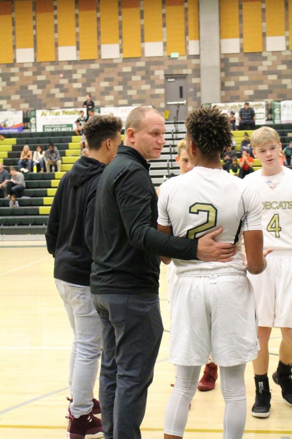 Varsity coach encourages Jayden during a timeout in the first game of the season against Mission Vista. The team banded together and we won 63-38.
