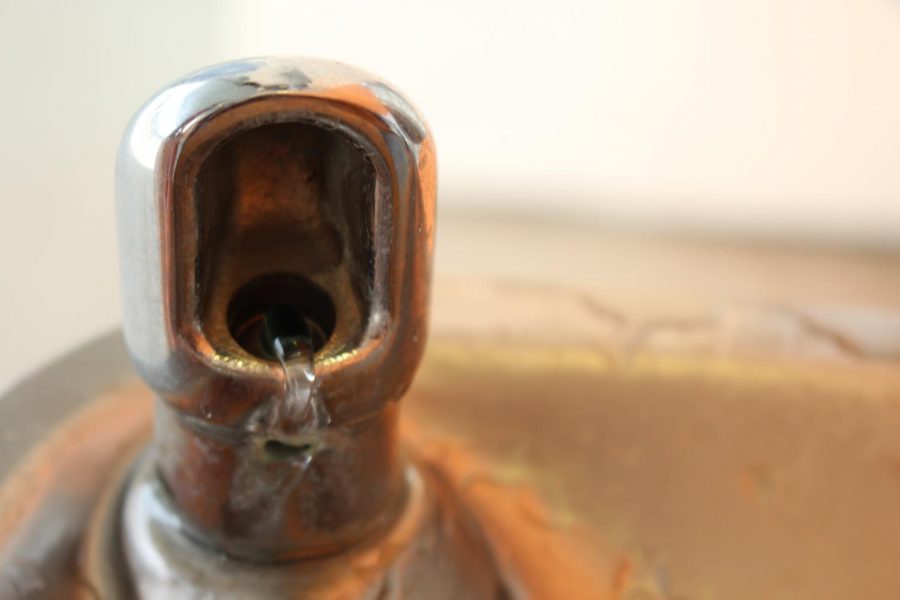 A barely functioning drinking fountain.  Often times students find difficulties in filling their water bottles or simply drinking straight from the fountains due to the low or even non-existent water pressure.