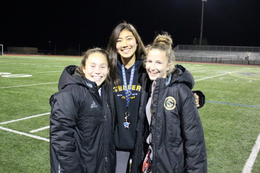 Bailee Brennan smiles excitedly with her fellow teammates after an imorpant team meeting discussing the moves they need to make to win CIF, before she goes off to UCSD to play D1 soccer.
