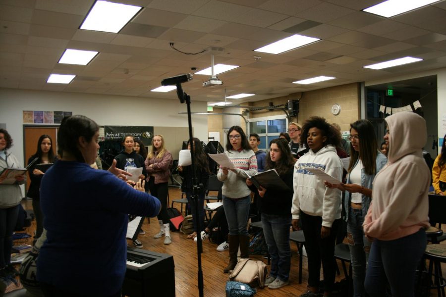 Dylan Goecke, Emily Parra, and Levi Folck practice their part of the alma mater. This is the
first year of having a choir class.