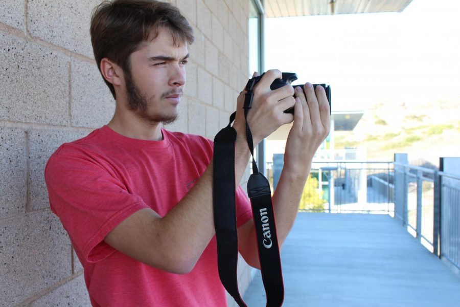 Chris Beauchamp preps the camera to get ready for the filming of a self produced film. 
