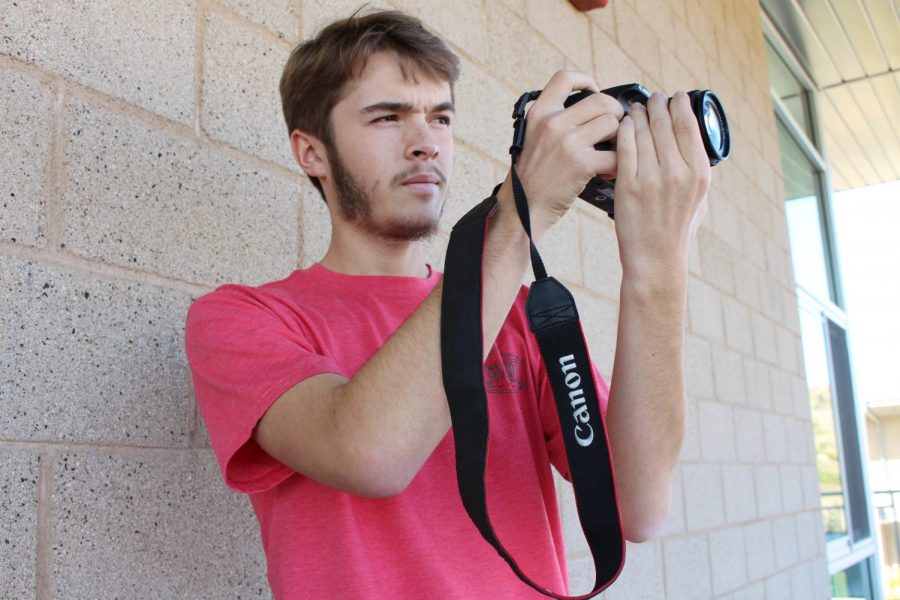 Chris Beauchamp preps the camera to get ready for the filming of a self produced film. 
