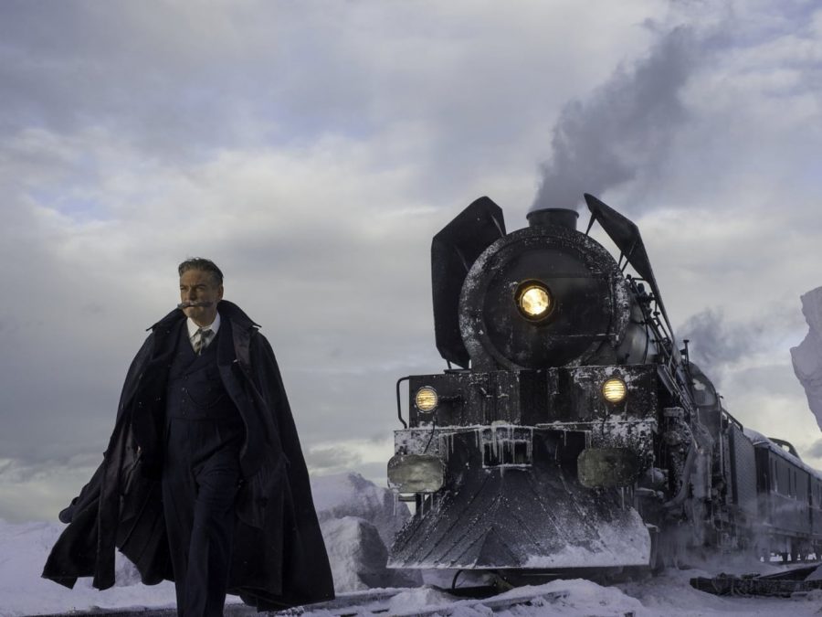 The main character, Hercule Poirot stands next to the train, attempting to solve a murder.