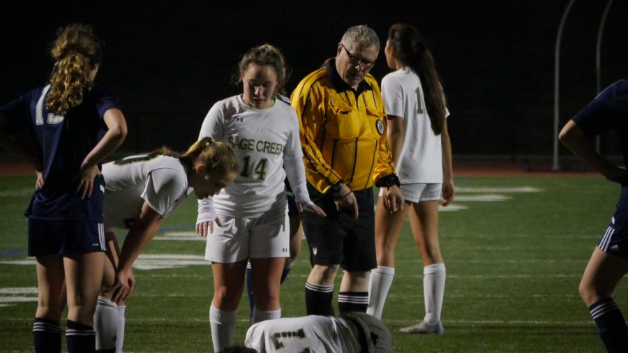 The Referees debate whether to punish a player after the accident. 