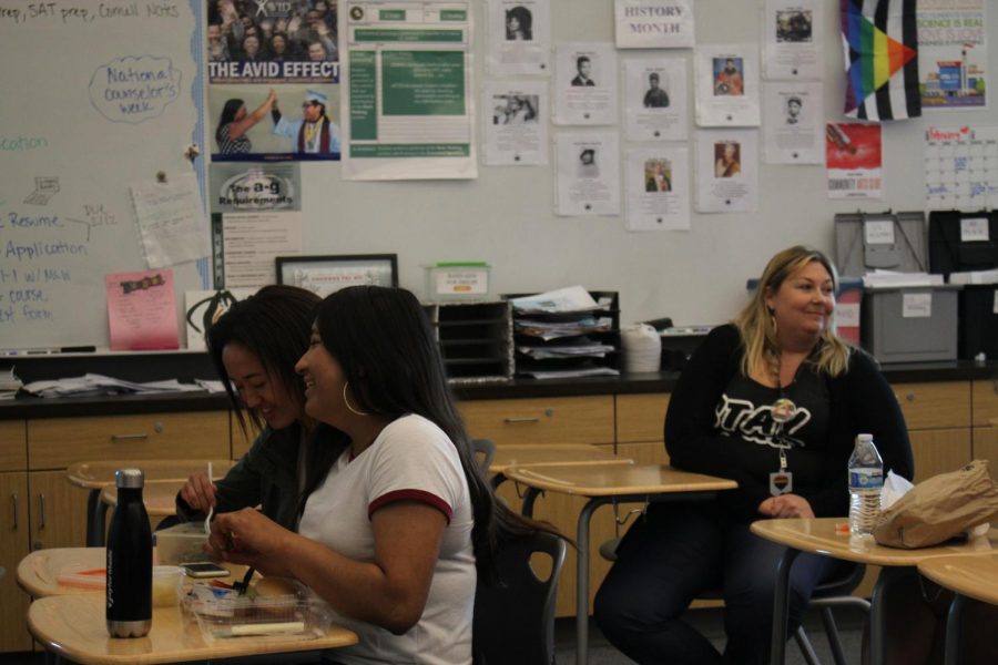 Members interact with each other as the meeting takes a pause. 
