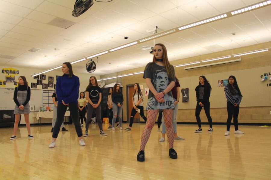 Senior Alex Morel practices a routine with the rest of the dance team during one
of the team’s daily after school practices. Morel is one of the three captains of the team.