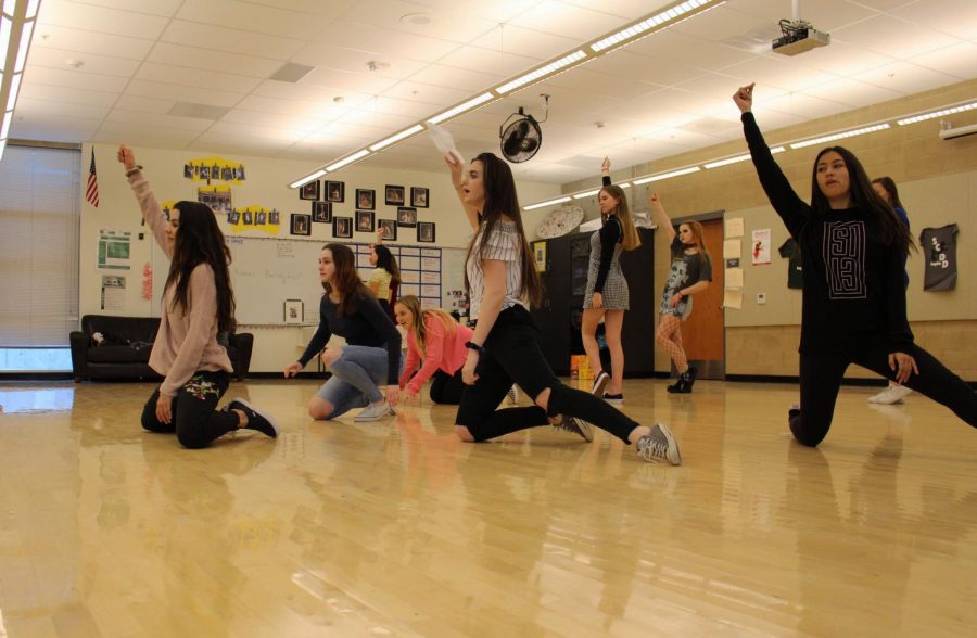 Dance team members practice a routine at one of their daily after school
practices. The team performs often at Sage Creek school assemblies and at half time
during sports games.