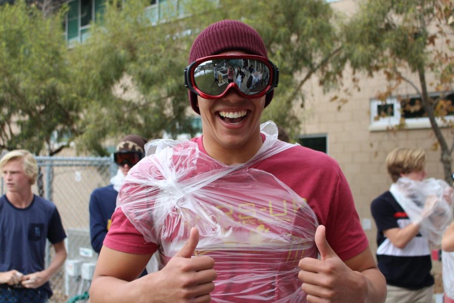 ASB president, Duncan Kelly, is seen giving his fellow classmates two thumbs' up before diving into the soapy mess.