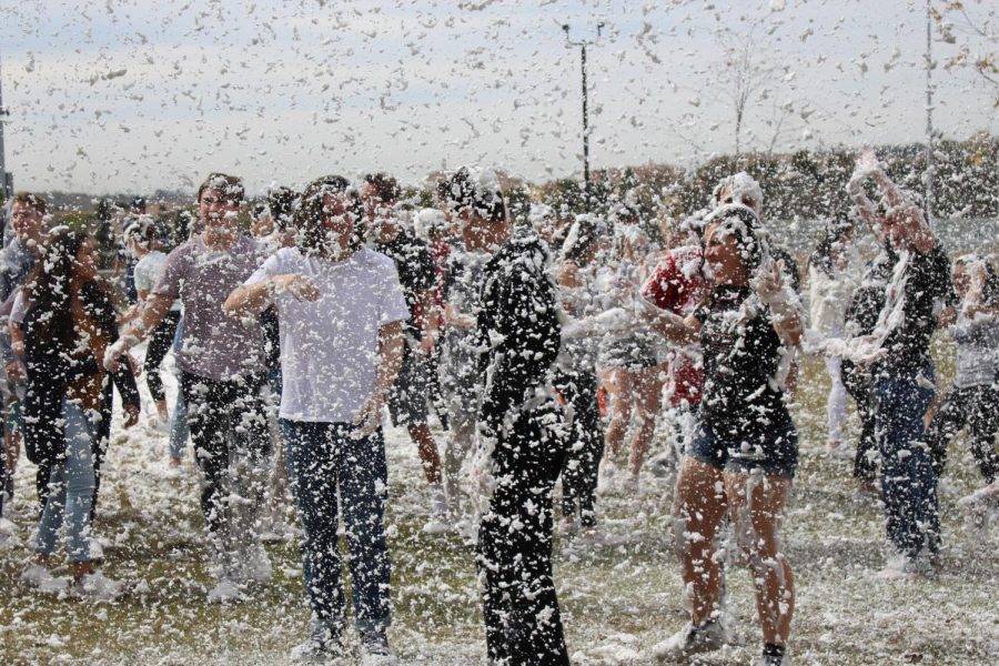 Sage Creek students jump and play in the SnoFoam during lunch on the third day of the Hoopcoming festivities.