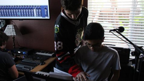 Overbey and Florentino try to figure out the tempo to a song while Davis adjusts sound levels.