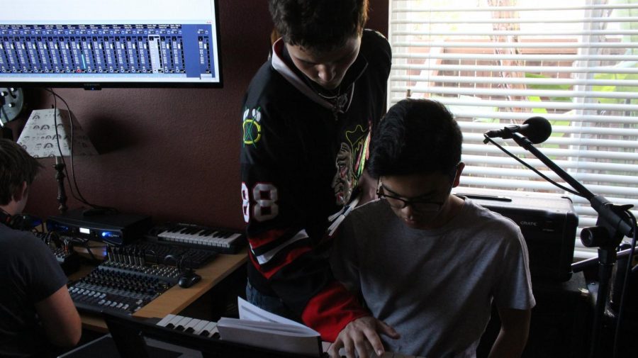 Overbey and Florentino try to figure out the tempo to a song while Davis adjusts sound levels.