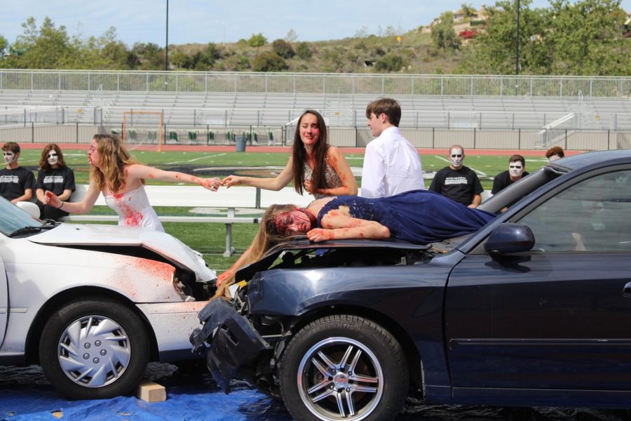 Senior Lea Marquez wallows in pain as she cries out for the loss of close friend, Summer Fitzgerald, in the crash scene on Tuesday.