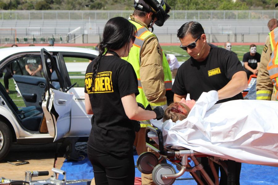 Junior Summer Fitzgerald is wheeled away by coroners in the staged accident on Tuesday.