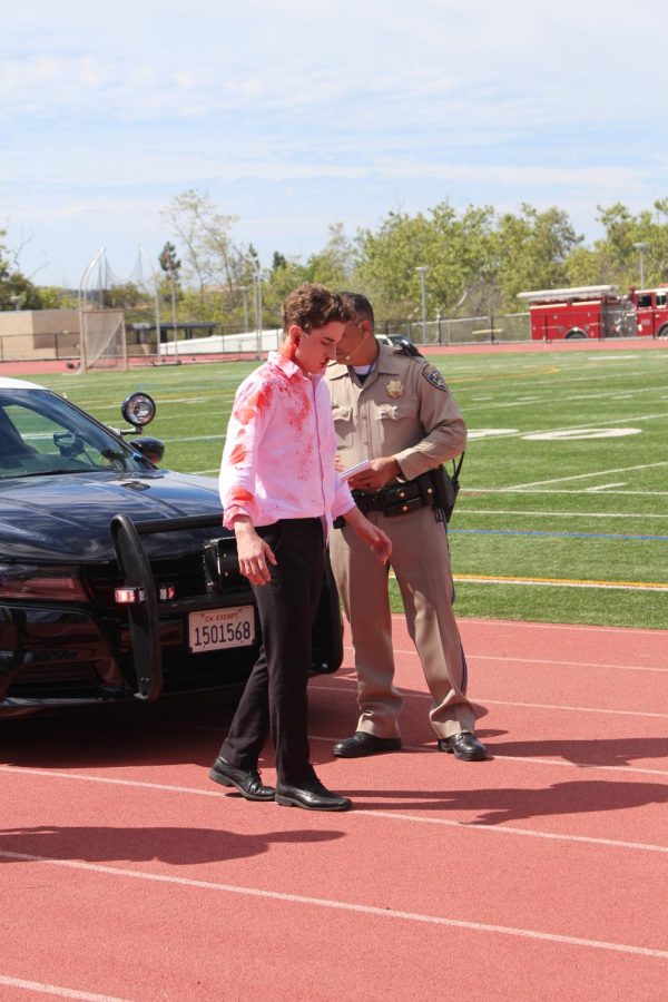 Senior Connor Tabone is seen being tested for driving under the influence during the Every 15 Minutes simulated incident.