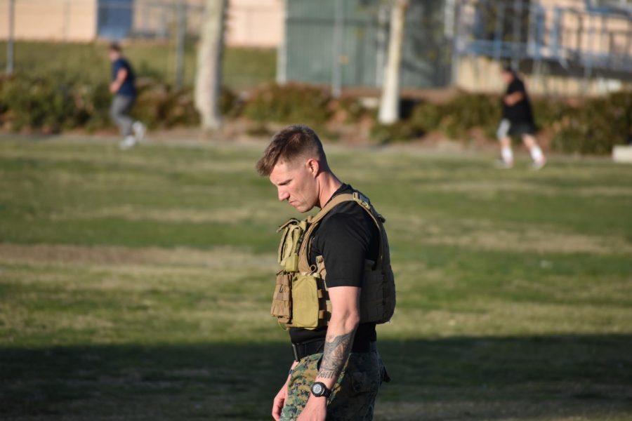 Sergeant Jolly leads the recruits in their physical training session.