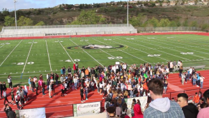 Students congregate at the field to observe the speeches and the reading of the Parkland victim’s name.