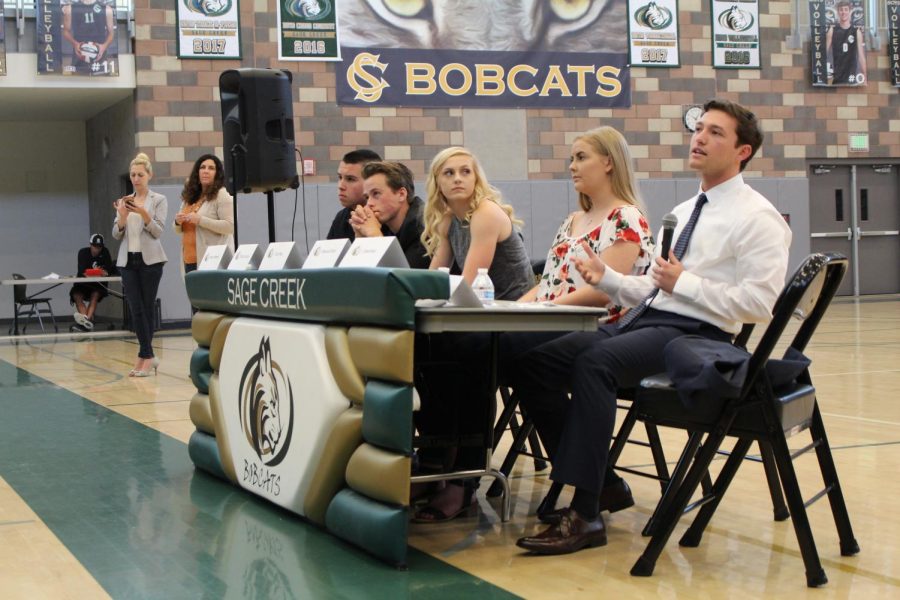 Sage Creek alumni Mike Townsend, Bryce Lincoln, Caly Ball, Shauna Davis, and Chris Saiki (pictured left to right) give advice to the freshman class of 2021. While the juniors and seniors were presenting their projects on the Genius Project Forum of April 26, the freshman class attended informational seminars on financial planning and literacy.