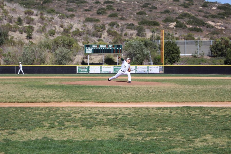 Junior Ethan Sakata throws a vicious pitch in the Sage Creek vs. Carlsbad High School baseball game.