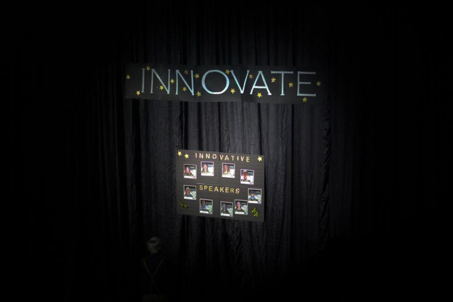 Innovate: the thematic concept that was present throughout the entirety of the 2017-2018 Genius Project Symposium. This sign had been cascaded amongst the far left wall of the Gym and had depicted all of the 17 various speakers that would be represented both on screen and on stage.