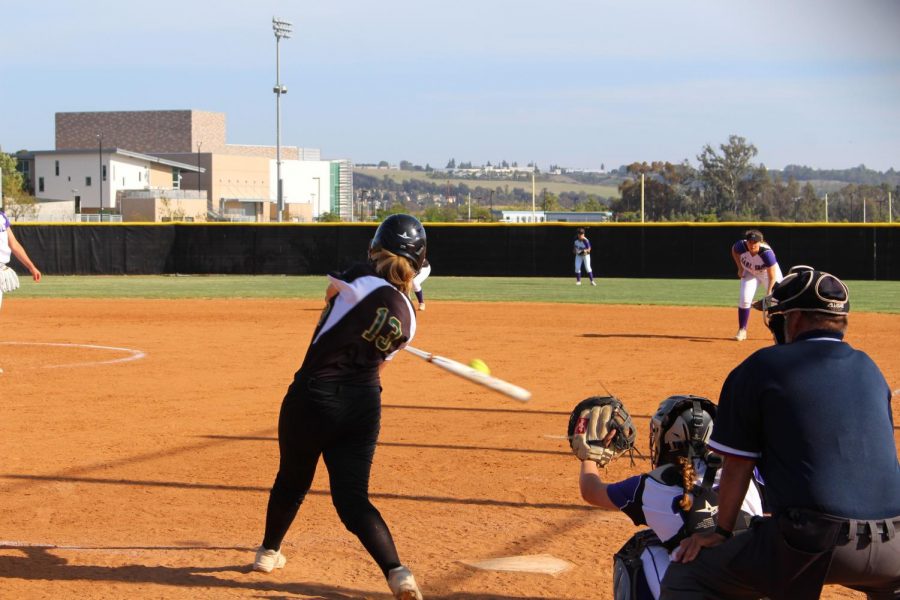 Junior Kendal Clibrum smacks the ball toward the second basemen.