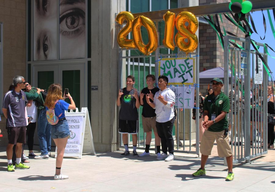 Campus supervisor, Dan DeLeon stands by Sage Creek’s front entrance in order to say some of his final goodbyes to the class of 2018. 