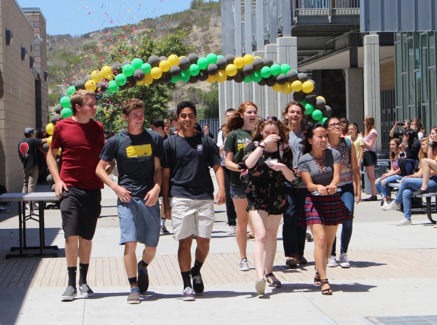 Members of Mrs. Alberts advisory class take the lead as the first group of students to walk down the academic mall during the senior walk off of 2018.