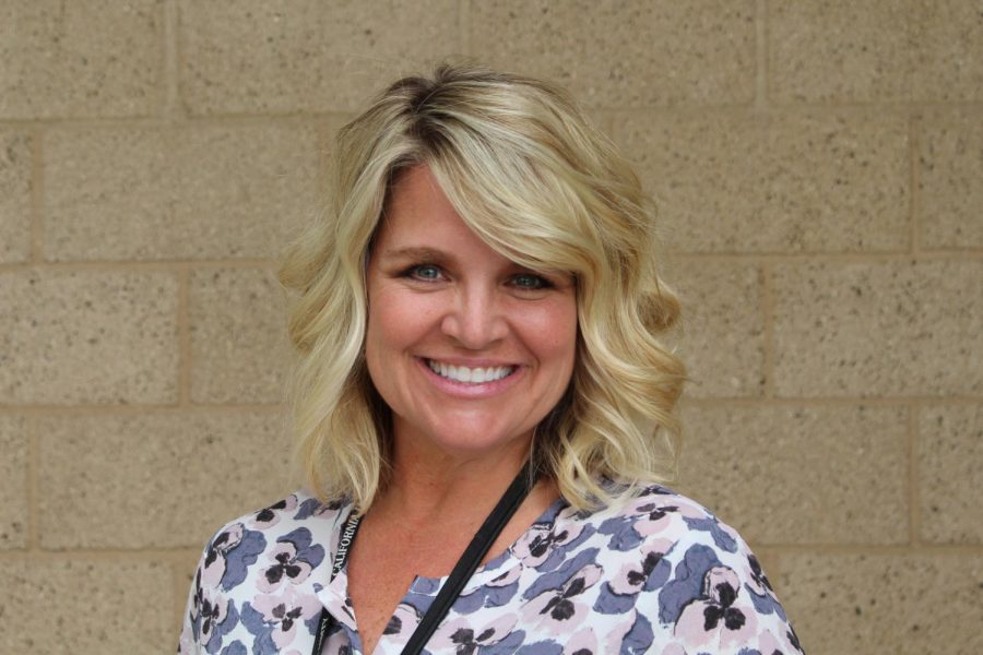 Mrs. Hatter poses outside of the office where she works hard everyday to make our school a better place. Hatter received the Classified Staff Member of the Year Award at the recognition assembly on May 23, 2018 for all the effort she has put in to improving our school.