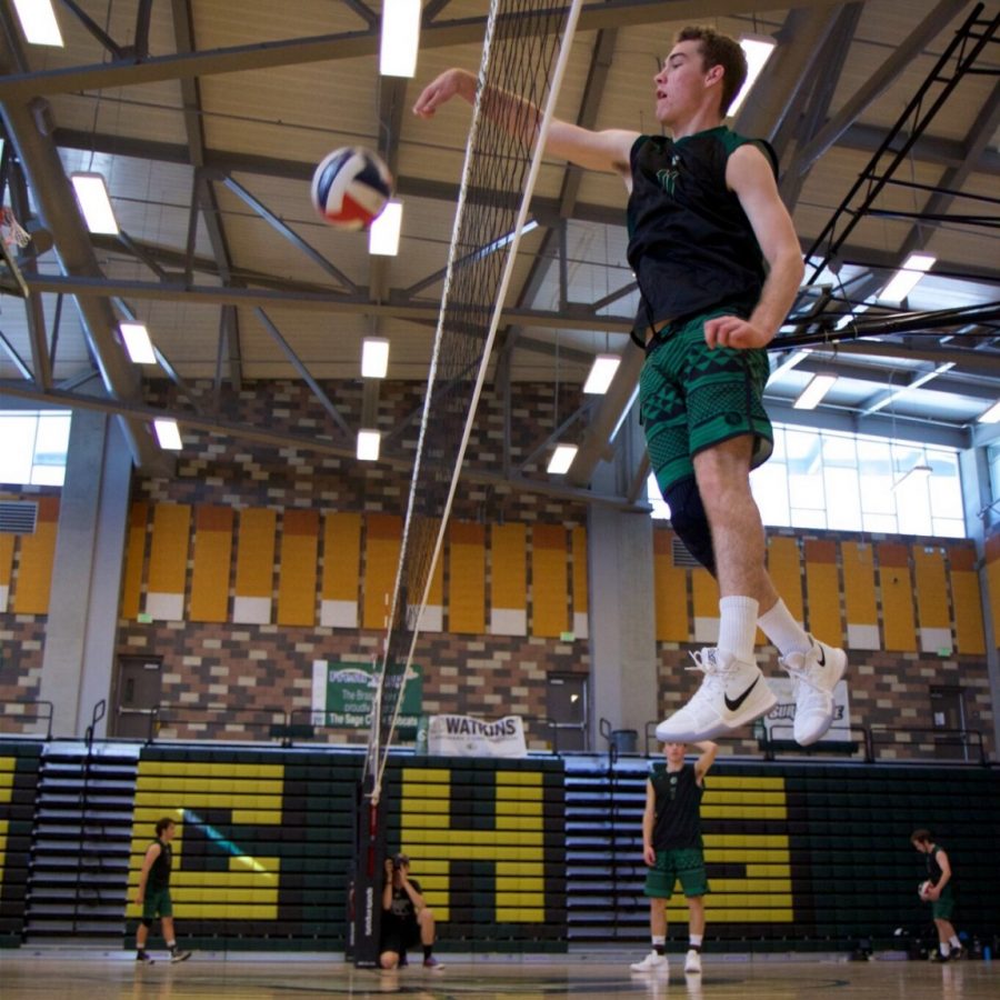 Christian Janke spikes the ball down on his competitions side. Janke stepped up again this season and led his team to a winning season.