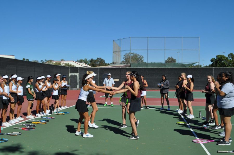 Sage Creek’s girls tennis team conclude their game against Rancho Buena Vista with handshakes and smiles. The tennis team took home a win with a score of 16-2 against the longhorns and will be competing against San Dieguito Academy at 3pm this Thursday, Sept. 27.