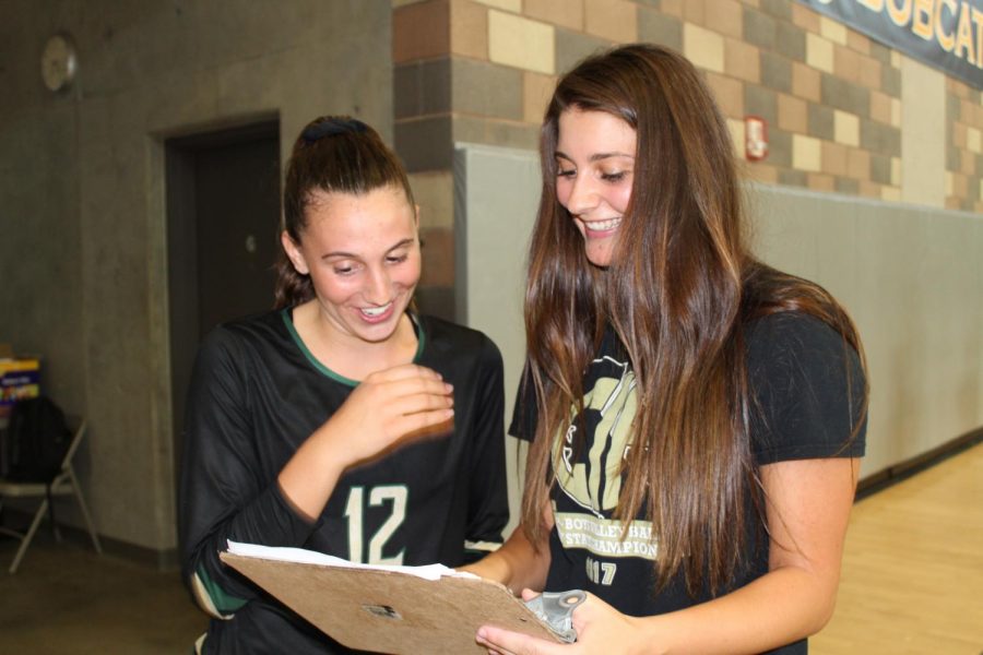 Junior Varsity coach Ana Huberty discussing game plans with freshman player Brooke DeGraan in the Bobcat Arena. The JV team competed against Mission Hills High School on Sept. 11.