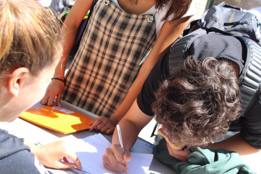 Sage Creek students crowding around to sign up for Staff vs. Students Flag Football game that will take place on Oct. 5th. The Flag Football Tournament is more recently transforming into a yearly tradition for the Bobcat Nation and sign-up’s to participate in the event will continue until Friday, Sept. 28.