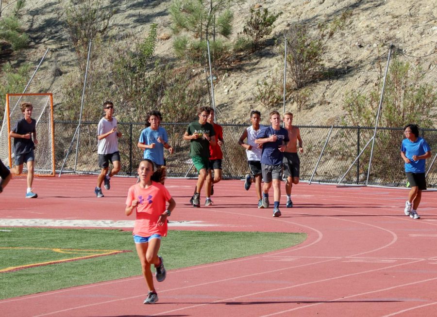 Sage Creek’s cross country team practices on the track after school on Monday, Oct. 8. During practice, athletes completed a “tempo run” to simulate race pace conditions.