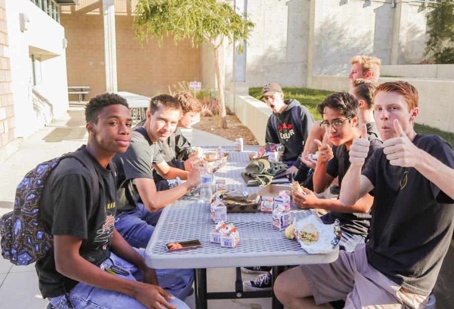 A group of seniors enjoy breakfast burritos served to them after the annual senior panoramic photo. Seniors were also provided with complementary sides of fresh fruit and juice.