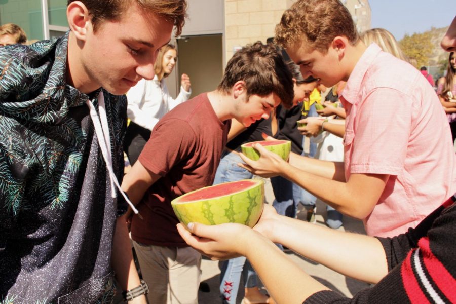 Contestants are ready to face off in the watermelon eating contest at lunch on Thursday, Oct. 25. Participants raced to finish the watermelon with their hands behind their back. 