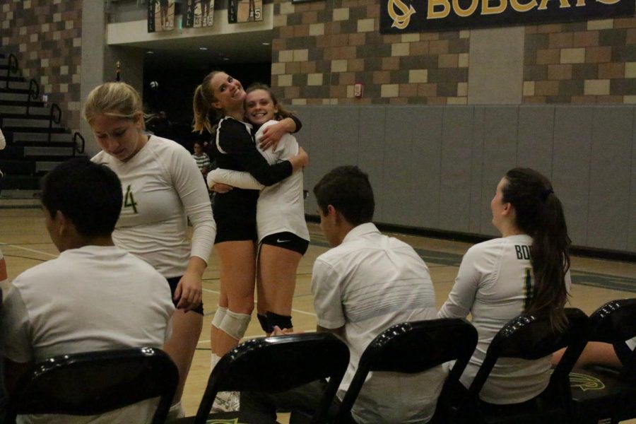 Seniors Samantha Blackburn and Courtney Clexton hug it out after winning their State Championship game. With this win, the girls scored 25-18 and ultimately  defeating the other team. 