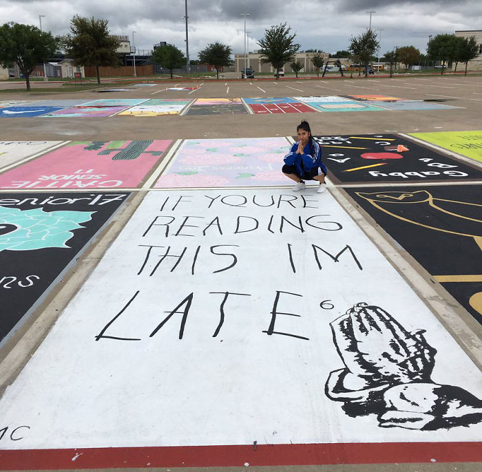 Martha Caldera, a senior at West Orange High School, is posing in front of her pop culture design that illustrates a punch-line about tardiness. She recreated her favorite artist Drake’s album If You're Reading This It's Too Late with her own take that reads, "If you're reading this I'm late." 