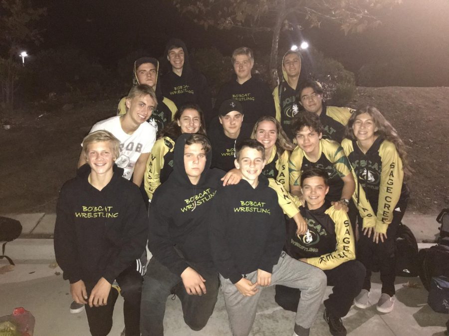 The wrestling team poses for a photo after returning from their first duel of the 2018-2019 season. They wrestled Canyon Crest Academy on Thursday, Nov. 29, after a hard fight and the first match for many of the wrestlers, they lost 59-11. With this concluding score, wrestlers Mo Gill, Cole Kirby, Luke McLellan and Kylie Valency walked away with a win.