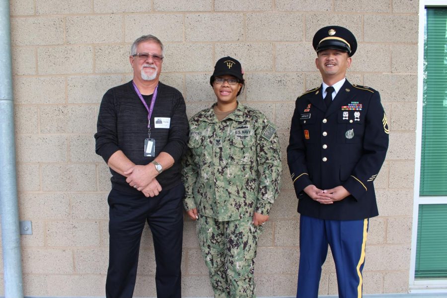 Three AVSAB test proctors pose in between tests on Tuesday, Dec. 11. The Armed Services Vocational Aptitude Battery (ASVAB) is a multiple choice test, administered by the United States Military Entrance Processing Command, used to determine qualification for enlistment in the United States Armed Forces.