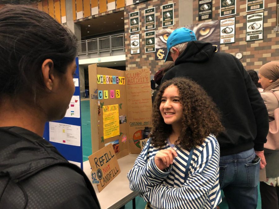 An incoming eighth-grader asks junior Lavanya Pandey about Science Olympiad. Many clubs, sports and classes were on display at this year’s Eighth Grade Showcase Tuesday evening, especially ones that could be pivotal in the eighth graders’ decisions on which of the high schools would be the best fit. 