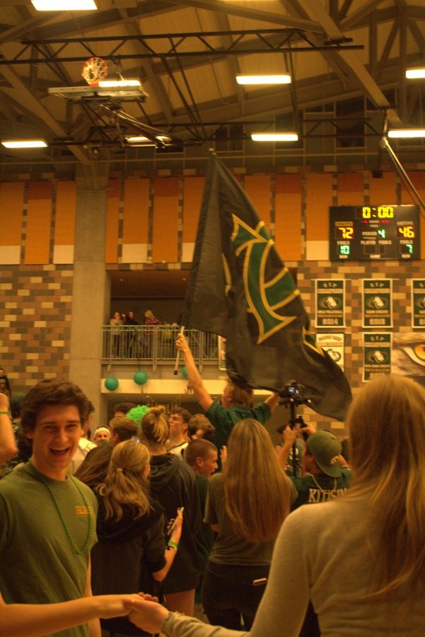 After an impressive 72- 46 win for the boys basketball team against Oceanside High School, Bobcat fans take to the court to celebrate the victory. 