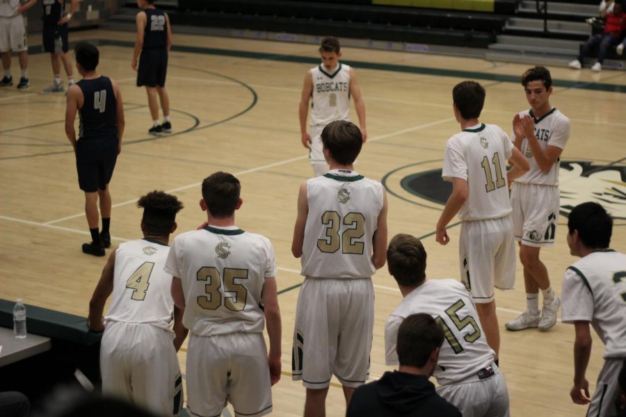 Players get ready to come into the game. Substitutions were necessary as almost everyone on the team got a piece in the scoring.