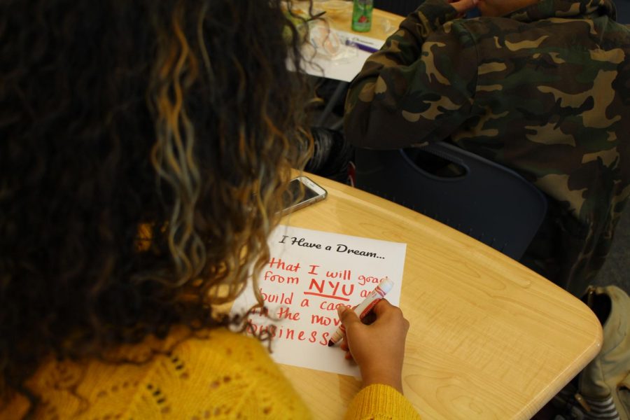 A BSU member fills out an "I Have a Dream" paper at a meeting. BSU gives students the chance to ask questions about events that others might not understand.